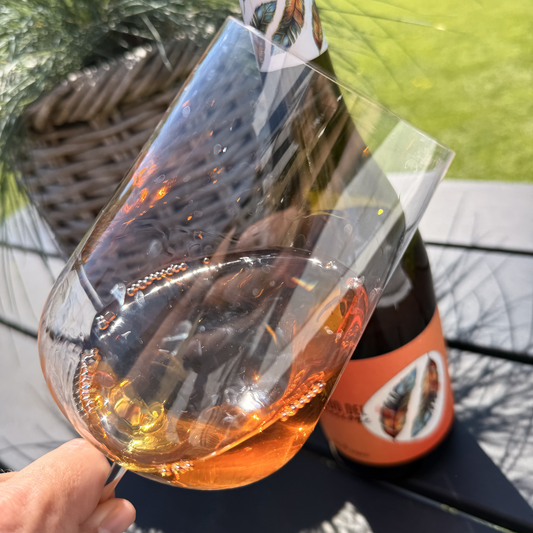 Pouring Il Nido del Gruccione orange wine - Skin-contact Fiano with amber hues