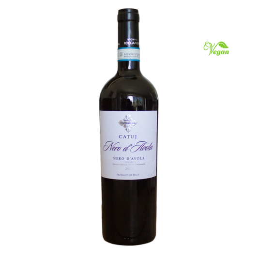 A bottle of Roccamena Nero d'Avola Catuj 2023 red wine with a label indicating it is a product from Sicily, Italy.