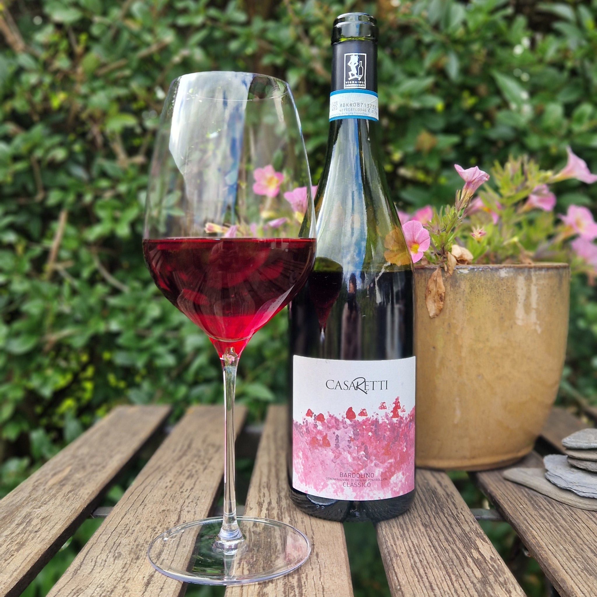 Close-up of Casaretti Bardolino Classico bottle in a chilled wine bucket - Highlighting the "serve chilled" recommendation.
