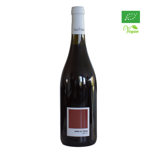 A bottle of Tenuta Demaio Nero di Troia red wine with an organic certification logo in the upper right corner.