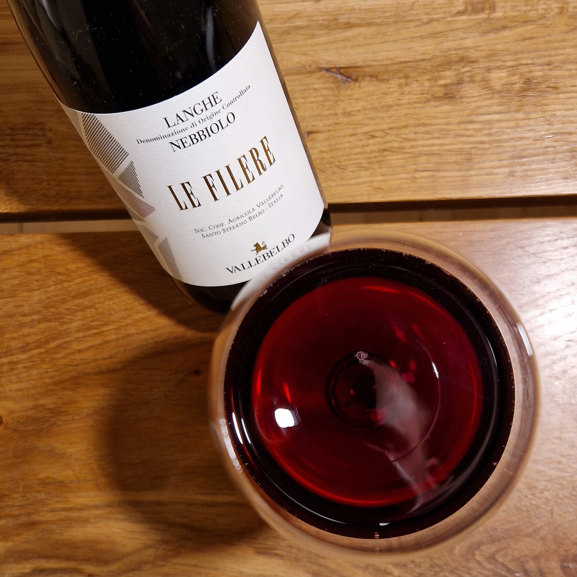 Pouring Langhe Nebbiolo into a crystal wine glass